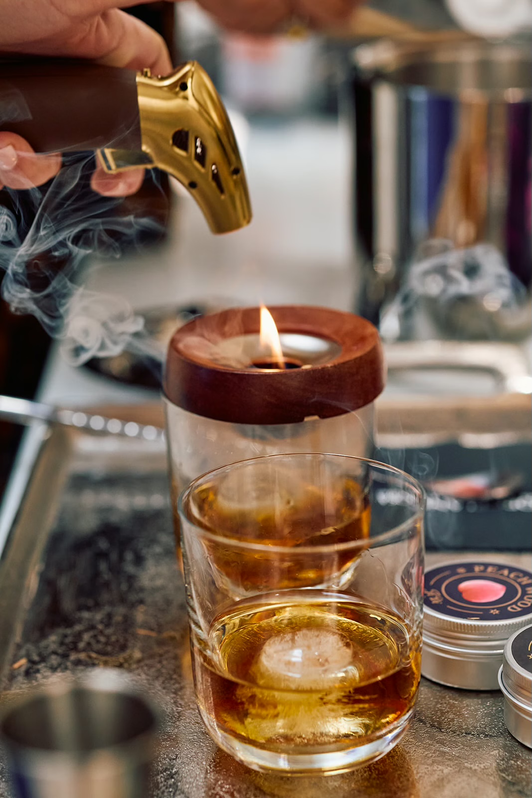 Styled mobile dry bar setup with smoked cocktail