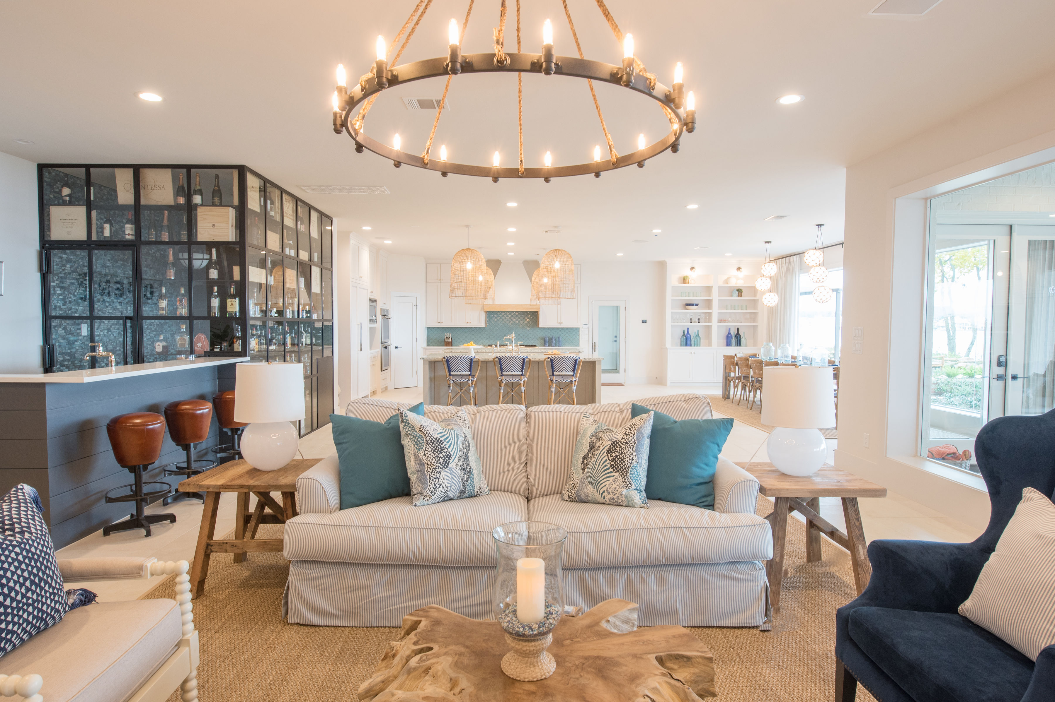 Bright coastal living room with chandelier