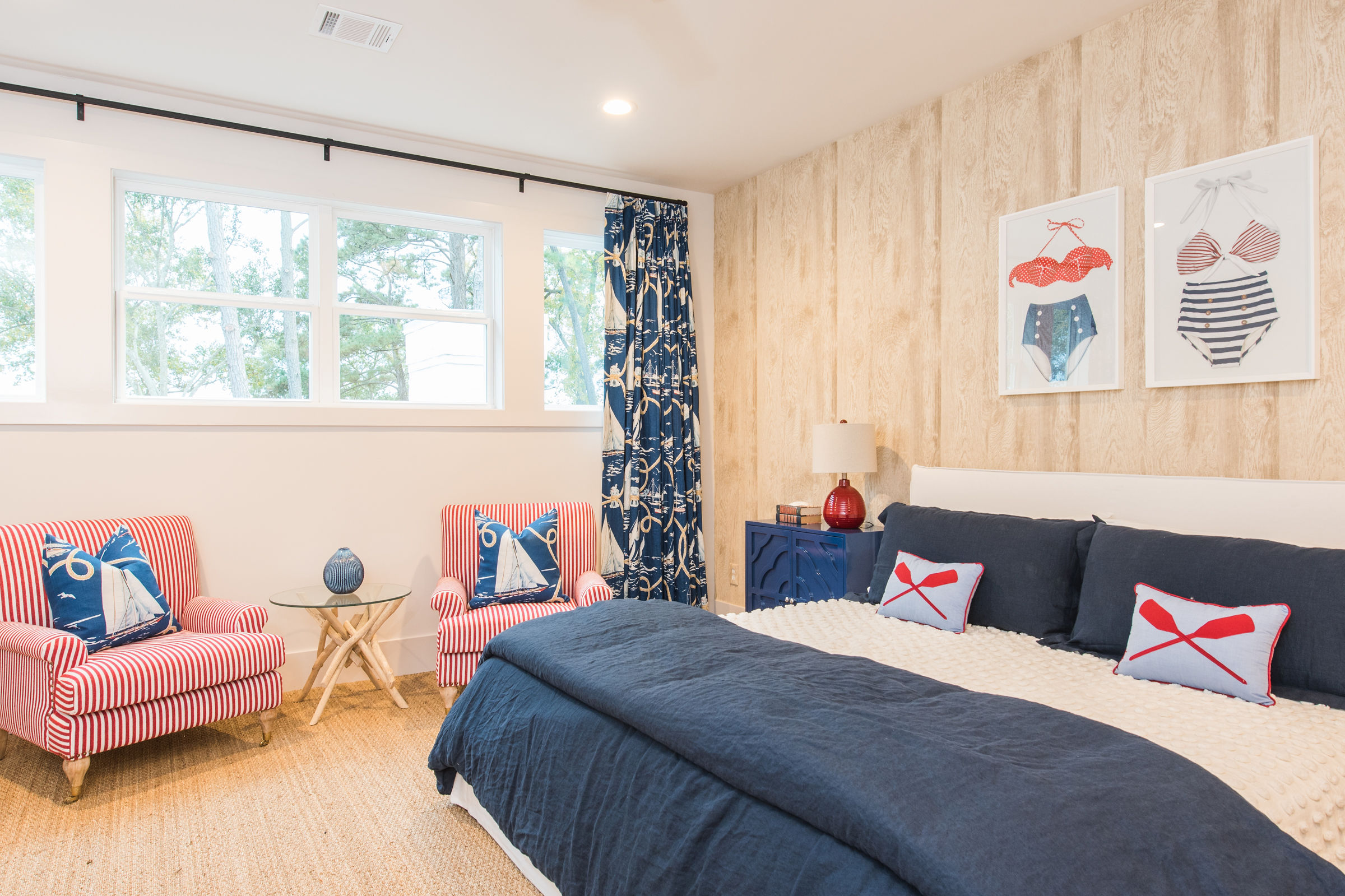 Nautical themed bedroom with blue and red accents